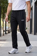 GR Apparel Piped Track Pants in black — front