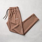 GR Apparel Piped Track Pants in mocha — front